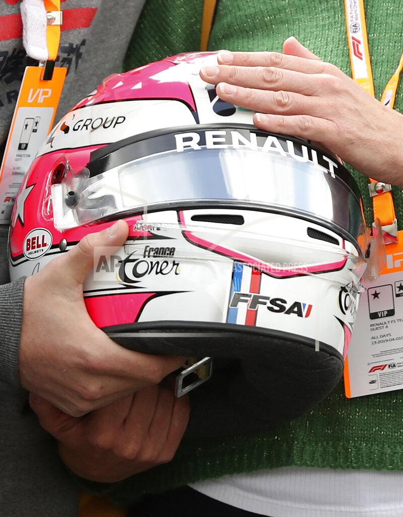 Francisco Seco The mother and brother of Anthoine Hubert hold the helmet of Formula 2 driver Anthoine Hubert during a moment of silence at the Belgian Formula One Grand Prix circuit in Spa-Francorchamps, Belgium, Sunday, Sept. 1, 2019. The 22-year-old Hubert died following an estimated 160 mph (257 kph) collision on Lap 2 at the high-speed Spa-Francorchamps track, which earlier Saturday saw qualifying for Sunday's Formula One race. (AP Photo/Francisco Seco)