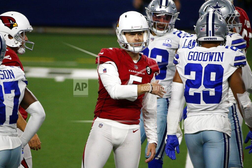 Michael Ainsworth Arizona Cardinals' Zane Gonzalez (5) celebrates his field goal as Dallas Cowboys' C.J. Goodwin (29) walks past in the second half of an NFL football game in Arlington, Texas, Monday, Oct. 19, 2020. (AP Photo/Michael Ainsworth)