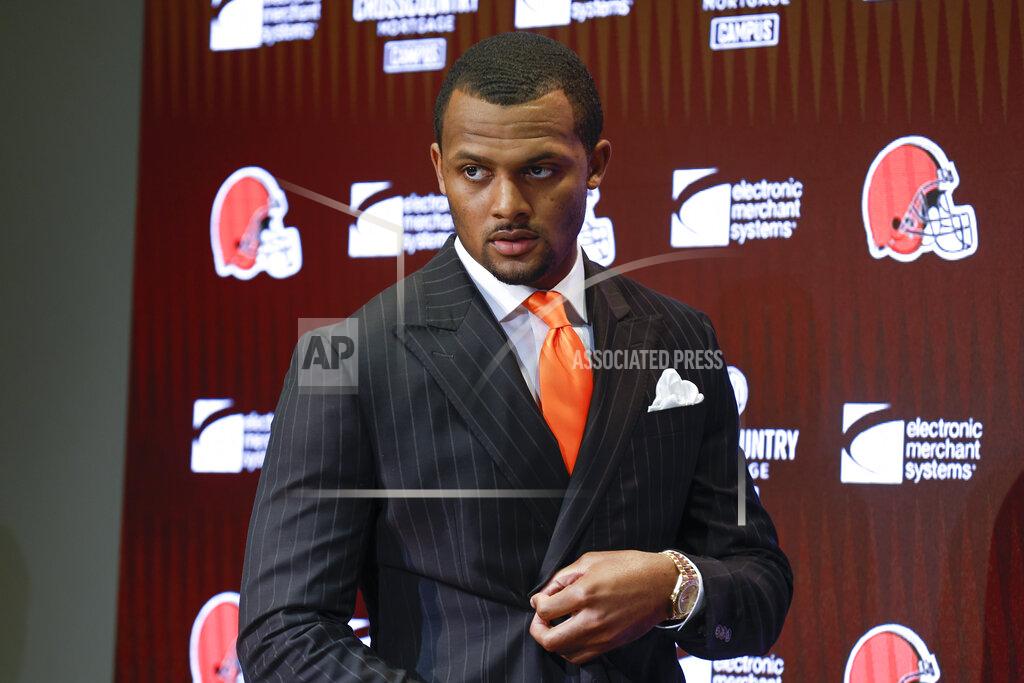 FILE - Cleveland Browns new quarterback Deshaun Watson enters a news conference at the NFL football team's training facility, Friday, March 25, 2022, in Berea, Ohio. Watson's first offseason program with the Cleveland Browns is the first chance for the controversial quarterback to meet new teammates. (AP Photo/Ron Schwane, File)
