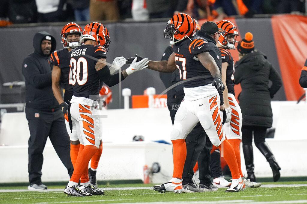 Aj Mast Cincinnati Bengals' Germaine Pratt (57) celebrates an interception with Jessie Bates (30) during the second half of an NFL wild-card playoff football game against the Las Vegas Raiders, Saturday, Jan. 15, 2022, in Cincinnati. Cincinnati won 26-19. (AP Photo/AJ Mast)