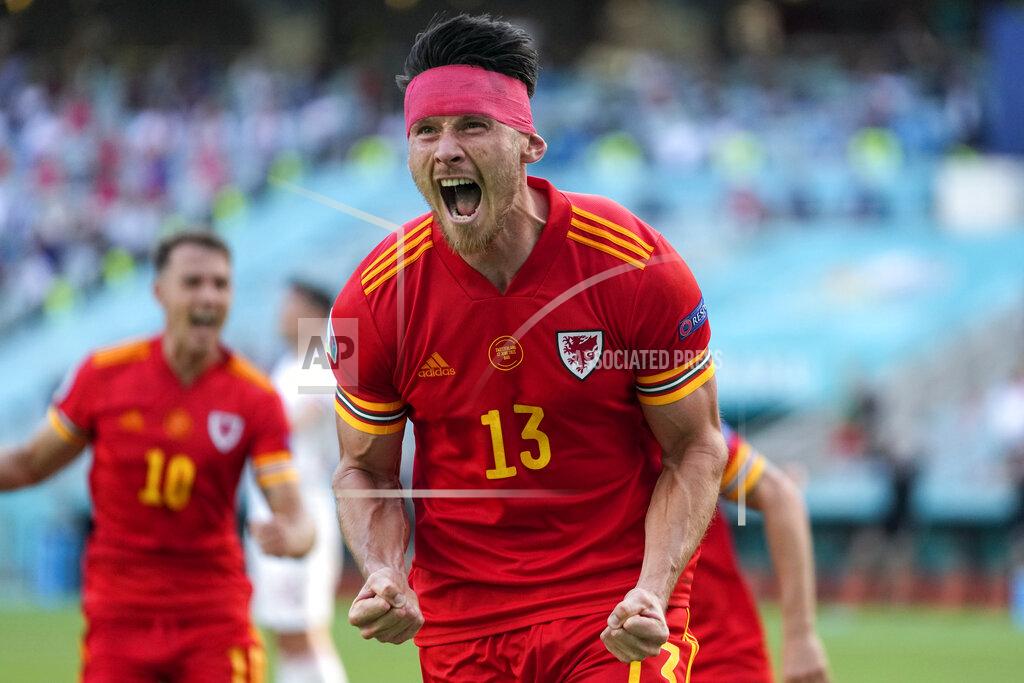 Darko Vojinovic Wales' Kieffer Moore celebrates after scoring his side's opening goal during the Euro 2020 soccer championship group A match between Wales and Switzerland, at the Baku Olympic stadium, in Baku, Azerbaijan, Saturday, June 12, 2021. (AP Photo/Darko Vojinovic, Pool)