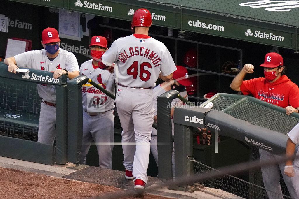 Nam Y. Huh St. Louis Cardinals' Paul Goldschmidt (46) celebrates with coaching staff members after hitting a three-run home run during the third inning of a baseball game against the Chicago Cubs in Chicago, Sunday, Sept. 6, 2020. (AP Photo/Nam Y. Huh)