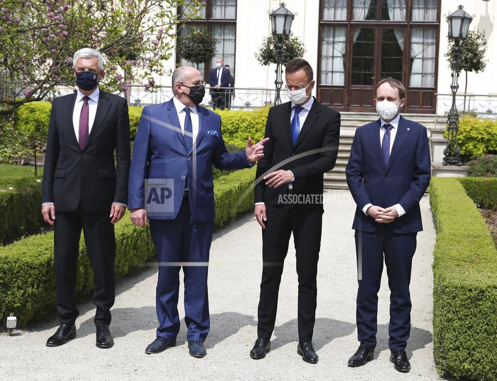 Czarek Sokolowski Slovak Foreign Minister Ivan Korcok, left, Polish Foreign Minister Zbigniew Rau, Hungarian Foreign Minister Peter Szijjarto and Czech Republic Foreign Minister Tomas Petricek, right, after meeting the foreign ministers of the Visegrad Group ,V4, in Lodz, Poland, Friday, May 14, 2021. (AP Photo/Czarek Sokolowski)