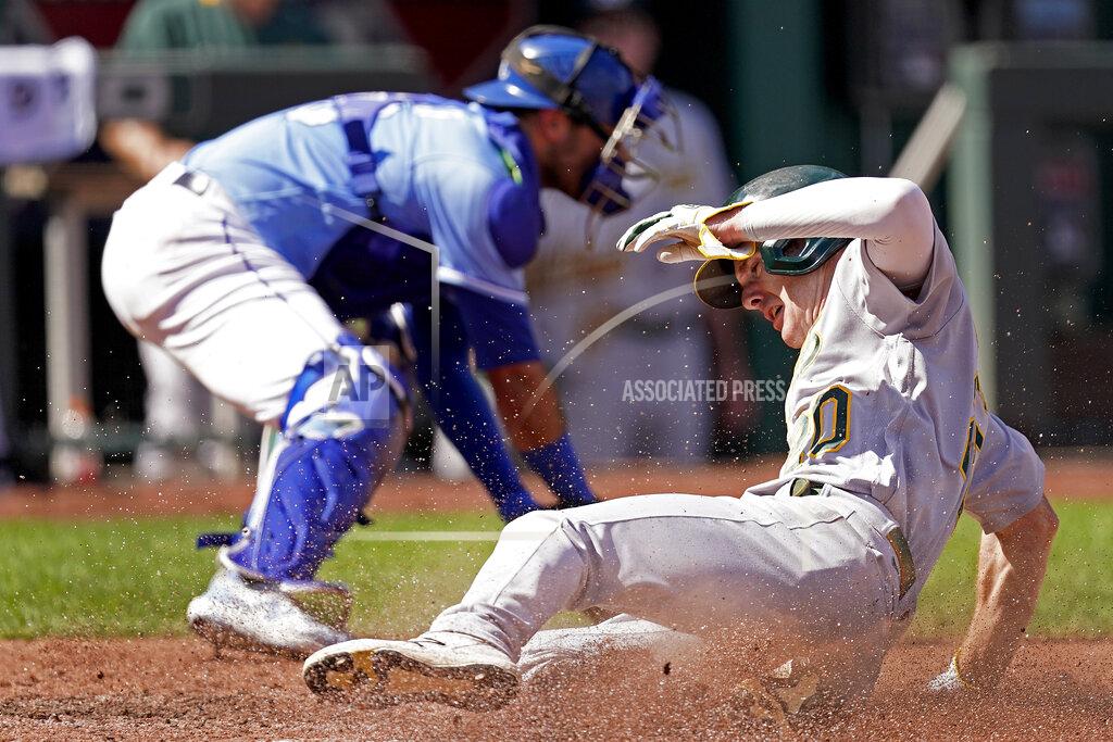 Charlie Riedel Oakland Athletics' Mark Canha slides home to score on a single by Chad Pinder during the third inning of a baseball game against the Kansas City Royals Thursday, Sept. 16, 2021, in Kansas City, Mo. (AP Photo/Charlie Riedel)