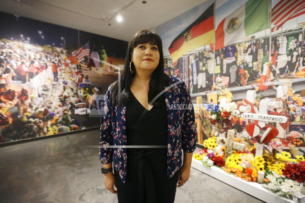 Briana Sanchez Curator Erica Marin works on "Resilience" the Aug. 3, 2019 Walmart memorial art exhibit Friday, July 24, at the El Paso Museum of History in El Paso. Marin and museum staff have gone through items left at the Walmart memorial that has been in storage and created an art exhibit for resilience and healing. (Briana Sanchez/The El Paso Times via AP)