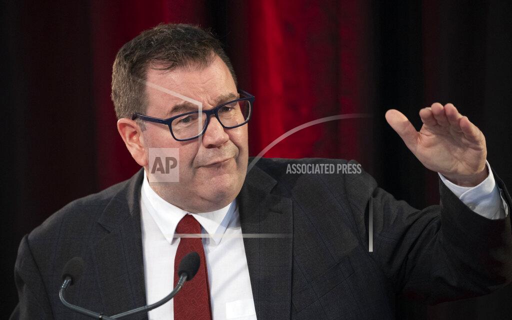 Mark Micthell New Zealand Finance Minister Grant Robertson gestures during his presentation at the Budget lockup at Parliament in Wellington, New Zealand, Thursday, May 20, 2021. New Zealand plans to rebuild its Antarctic base and spend billions more on welfare payments as part of a spending program aimed at lifting the economy out of a coronavirus slump. (Mark Mitchell/NZ Herald via AP)