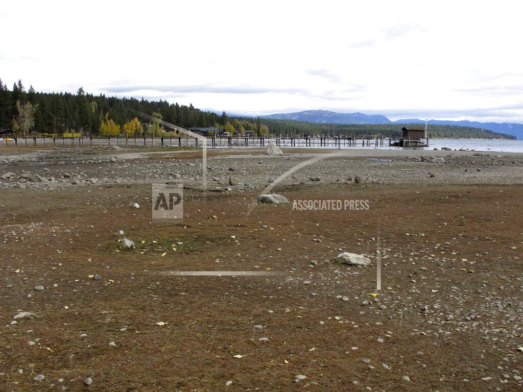 Scott Sonner A pier and dock sits above Lake Tahoe's receding shoreline Wednesday, Oct. 20, 2021 in Tahoe City, Calif. Drought fueled by climate change has dropped Lake Tahoe below its natural rim and halted flows into the Truckee River, an historically cyclical event that's occurring sooner and more often than it used to _ raising fears about what might be in store for the famed alpine lake. (AP Photo/Scott Sonner).