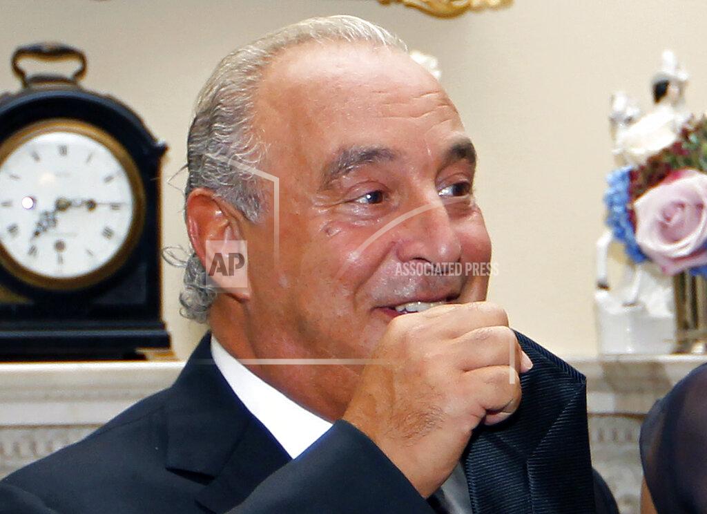 Sang Tan FILE - In this file photo dated Tuesday, Sept. 20, 2011, owner of fashion retail outlet Top Shop, Philip Green during a reception at 10 Downing Street in London. Some 15,000 retailing jobs in Britain are in peril after Arcadia Group, owner of some of the country's best-known fashion chains like Topshop, confirmed Friday Nov. 27, 2020, that it is in talks about its future. (AP Photo/Sang Tan, Pool)