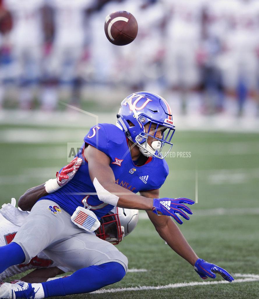 Reed Hoffmann Nicholls State defensive back Jonavon Lewis (27) knocks away this pass to Kansas wide receiver Stephon Robinson (5) during the first quarter of an NCAA college football game in Lawrence, Kan., Saturday, Sept. 1, 2018. (AP Photo/Reed Hoffmann)