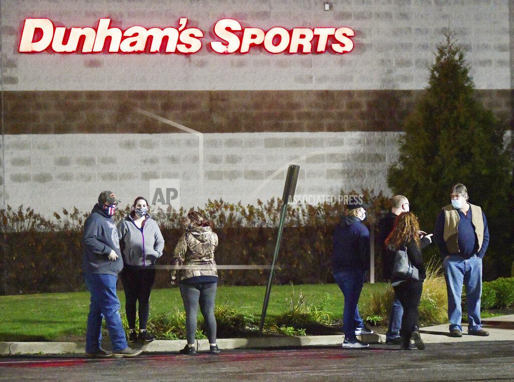 Warren Dillaway Black Friday early shoppers wait in line to get into Ashtabula Towne Square just before 6 a.m. on Friday, Nov. 27, 2020, in Ashtabula Township, Ohio. (Warren Dillaway/The Star-Beacon via AP)