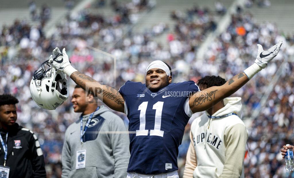 Joe Hermitt FILE - In this April 21, 2018, file photo, Penn State linebacker Micah Parsons acknowledges the crowd before the Blue-White spring college football game in State College, Pa. Last year, Parsons put together the greatest freshman season for a linebacker in Penn State’s long history. He says he learned that earning a starting spot takes more than making a bunch of tackles. (Joe Hermitt/PennLive.com via AP)