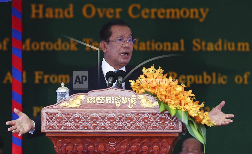 Lon Jadina Cambodian Prime Minister Hun Sen delivers a speech during a ceremony to hand over the Morodok Techo National Stadium, as it was handed over to the Cambodian organizing committee of the Southeast Asian Games, in Phnom Penh, Cambodia, Sunday, Sept. 12, 2021. China's Foreign Minister Wang Yi is visiting Cambodia, where he met with Hun Sen and other officials to discuss COVID-19 and other regional issues. (Lon Jadina/Pool Photo via AP)