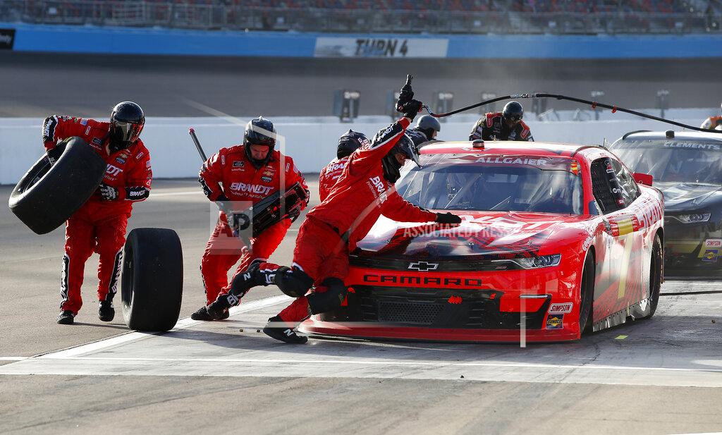 Ralph Freso The pit crew for Justin Allgaier (7) scramble around the car to change tires as he makes a pit stop during the NASCAR Xfinity Series auto race at Phoenix Raceway, Saturday, Nov. 7, 2020, in Avondale, Ariz. (AP Photo/Ralph Freso)