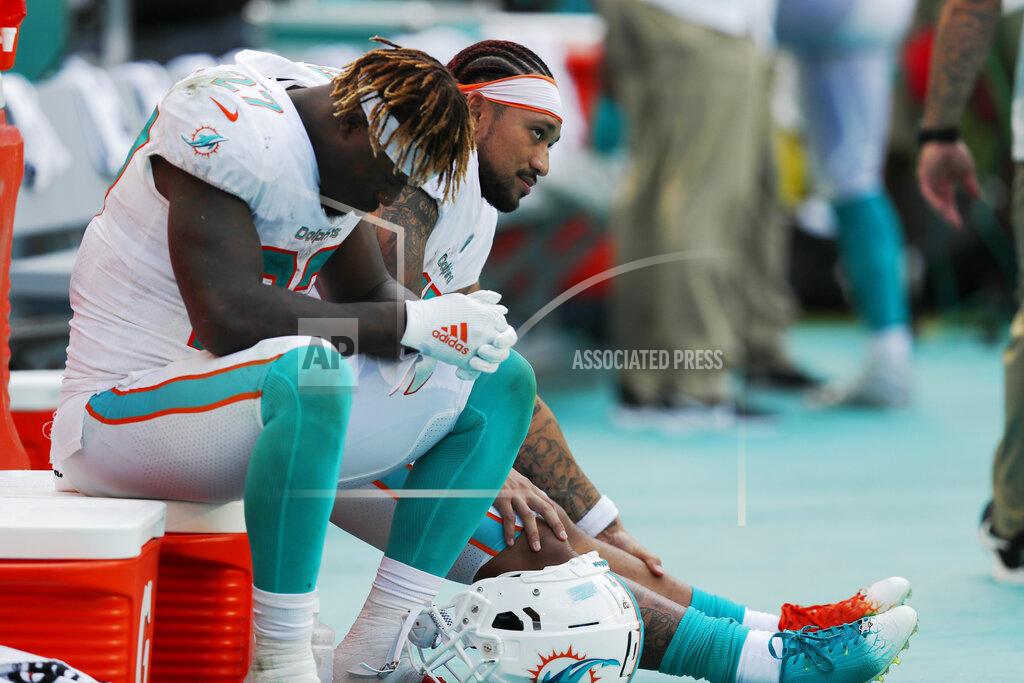 Brynn Anderson Miami Dolphins running back Kalen Ballage (27) sits on the sidelines, during the second half at an NFL football game against the Baltimore Ravens, Sunday, Sept. 8, 2019, in Miami Gardens, Fla. The Ravens defeated the Dolphins 59-10. (AP Photo/Brynn Anderson)