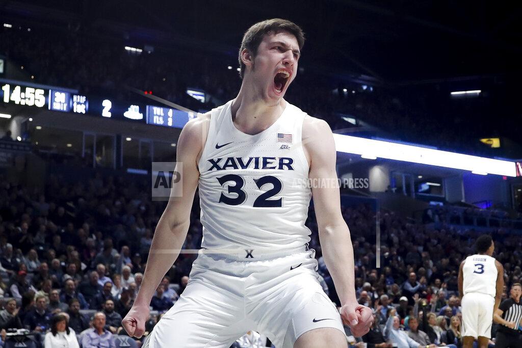 John Minchillo Xavier's Zach Freemantle reacts after dunking during the first half of the team's NCAA college basketball game against Jacksonville, Tuesday, Nov. 5, 2019, in Cincinnati. (AP Photo/John Minchillo)
