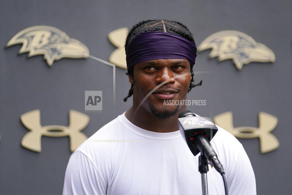 Baltimore Ravens quarterback Lamar Jackson talks to reporters during the team's NFL football training camp, Thursday, July 28, 2022, in Owings Mills, Md. (AP Photo/Julio Cortez)
