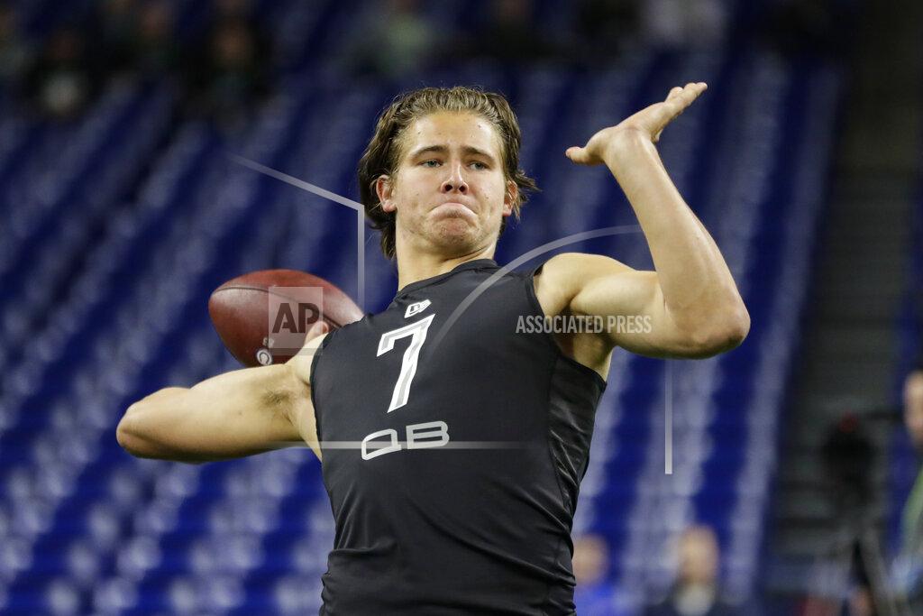 Michael Conroy Oregon quarterback Justin Herbert runs a drill at the NFL football scouting combine in Indianapolis, Thursday, Feb. 27, 2020. (AP Photo/Michael Conroy)