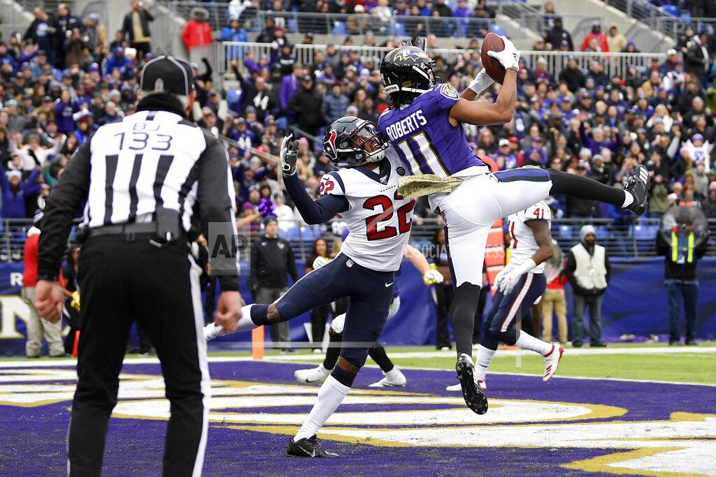 Nick Wass Baltimore Ravens wide receiver Seth Roberts (11) catches a touchdown pass from quarterback Lamar Jackson, not visible, as Houston Texans cornerback Gareon Conley (22) tries to stop him during the first half of an NFL football game, Sunday, Nov. 17, 2019, in Baltimore. (AP Photo/Nick Wass)