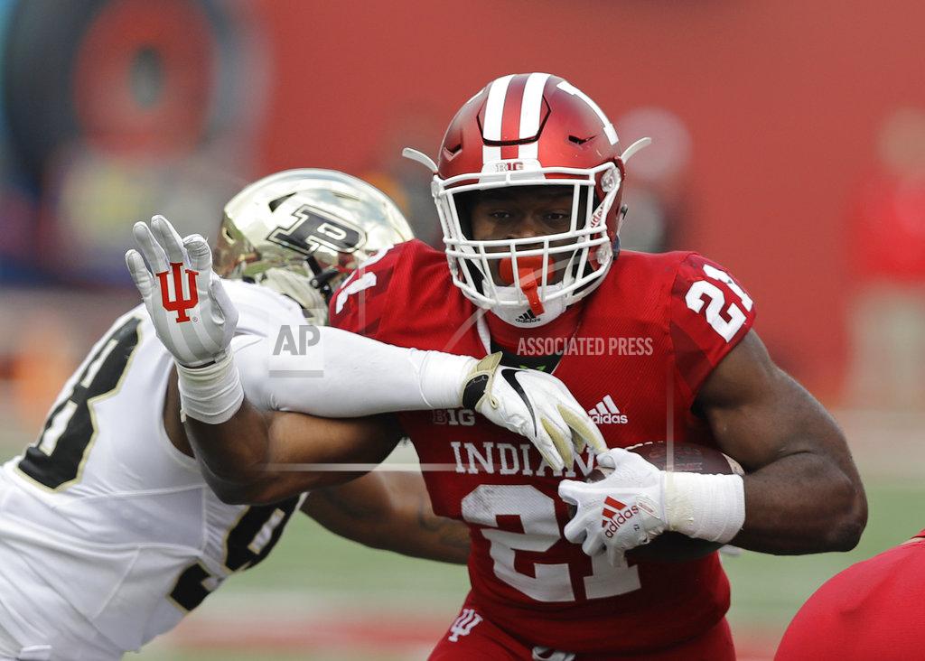 Darron Cummings Indiana running back Stevie Scott (21) runs out of the tackle of Purdue's Kai Higgins during the first half of an NCAA college football game, Saturday, Nov. 24, 2018, in Bloomington, Ind. (AP Photo/Darron Cummings)