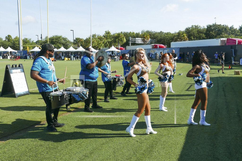 John Raoux Jacksonville Jaguars cheerleaders perform for fans along with the team drum line during NFL football practice, Saturday, July 31, 2021, in Jacksonville, Fla. (AP Photo/John Raoux)