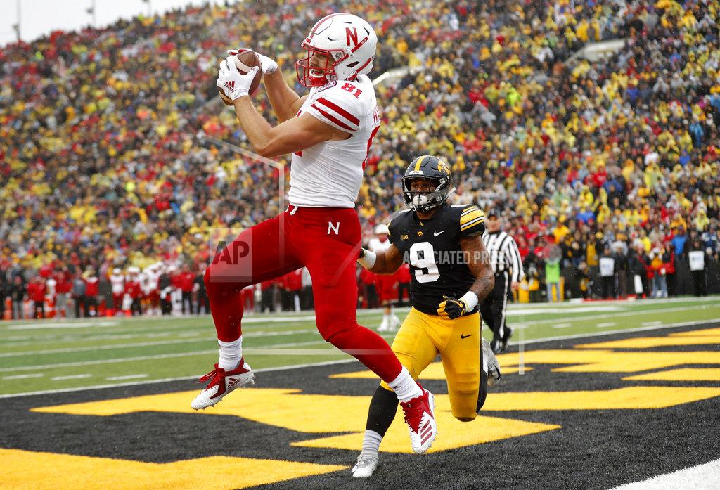 Charlie Neibergall Nebraska wide receiver Kade Warner catches a two-point conversion pass in front of Iowa defensive back Geno Stone (9) during the second half of an NCAA college football game, Friday, Nov. 23, 2018, in Iowa City, Iowa. Iowa won 31-28. (AP Photo/Charlie Neibergall)