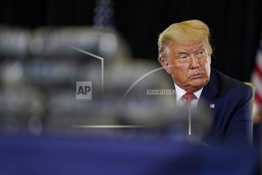 Evan Vucci President Donald Trump listens during a briefing on counternarcotics operations at U.S. Southern Command, Friday, July 10, 2020, in Doral, Fla. (AP Photo/Evan Vucci)