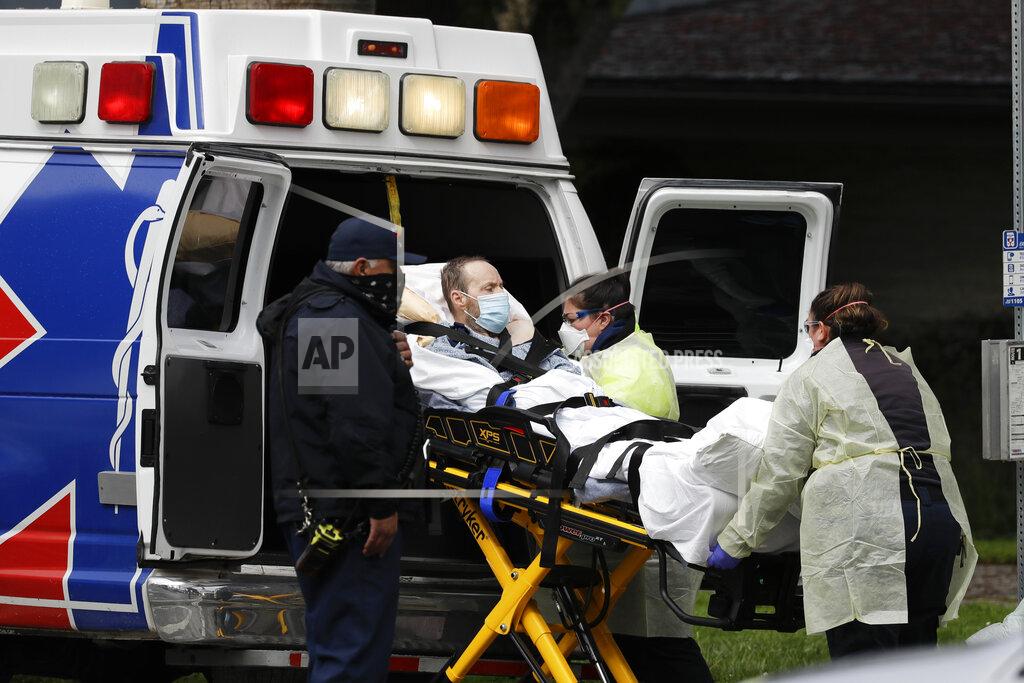 Chris Carlson A patient is evacuated from the Magnolia Rehabilitation and Nursing Center in Riverside, Calif., Wednesday, April 8, 2020. More than 80 patients from a Riverside skilled nursing facility are being evacuated this morning to other healthcare locations throughout Riverside County, Calif. (AP Photo/Chris Carlson)