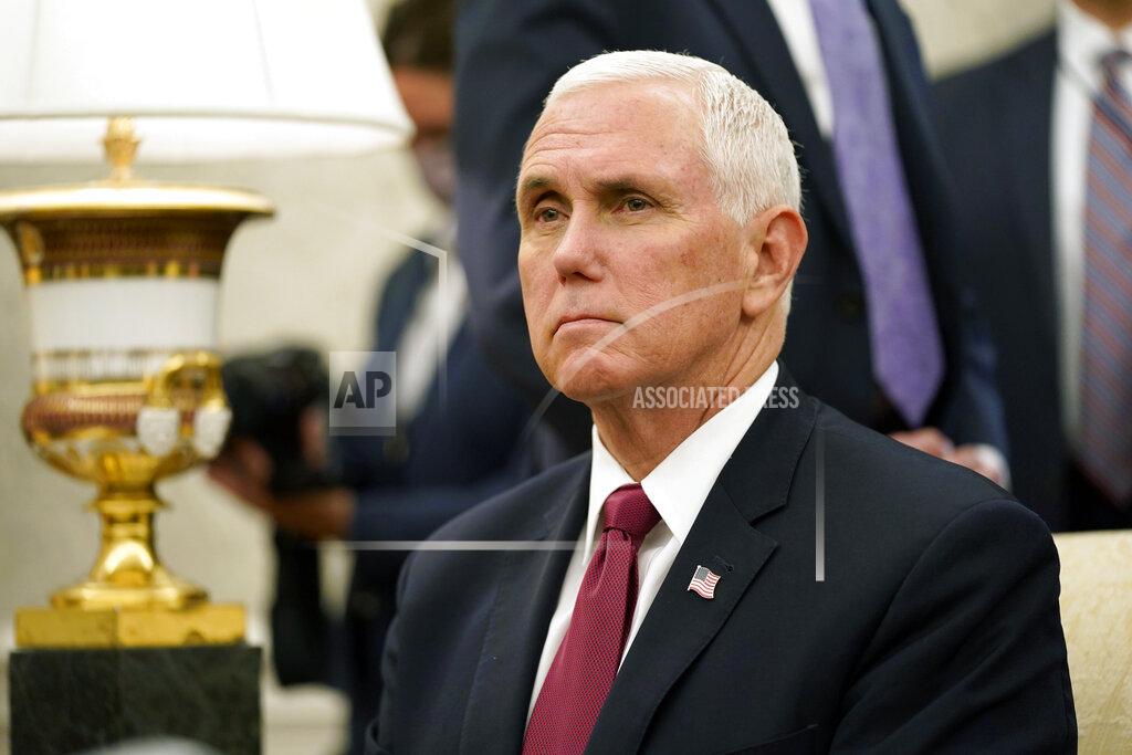 Vice President Mike Pence listens to a reporter's question during a meeting with President Donald Trump and Iraqi Prime Minister Mustafa al-Kadhimi in the Oval Office of the White House, Thursday, Aug. 20, 2020, in Washington. (AP Photo/Patrick Semansky)