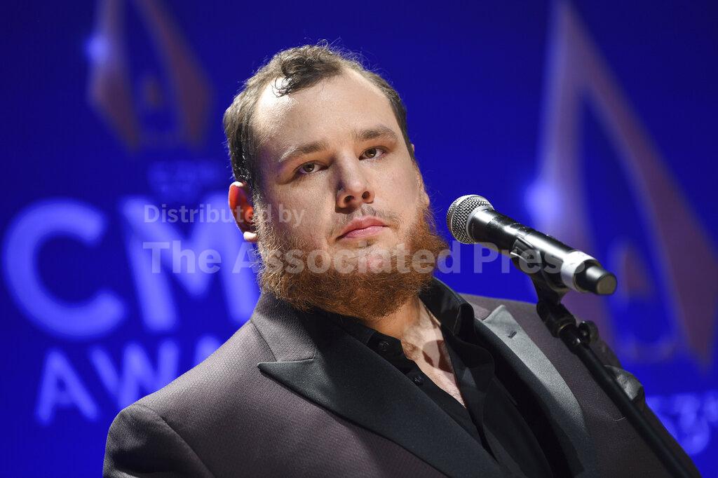 FILE - Singer-songwriter Luke Combs speaks in the press room after winning awards for male vocalist of the year and song of the year at the 53rd annual CMA Awards at Bridgestone Arena, in this Wednesday, Nov. 13, 2019, file photo. NASCAR will attempt some normalcy at the season-opening Daytona 500 with a live pre-race concert featuring country music star Luke Combs. (Photo by Evan Agostini/Invision/AP, File)