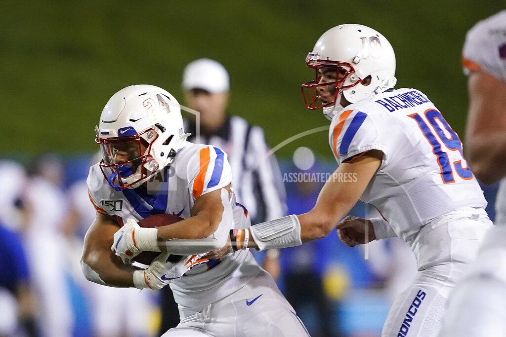 Tony Avelar Boise State quarterback Hank Bachmeier (19) hands off to running back George Holani (24) against San Jose State during the second half of an NCAA college football game, in San Jose, Calif., Saturday, Nov. 2, 2019. (AP Photo/Tony Avelar)