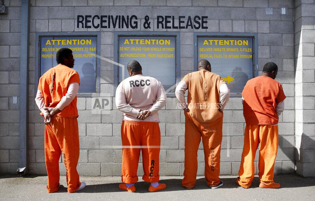 Rich Pedroncelli FILE - In this Feb. 20, 2014, file photo, prisoners from Sacramento County await processing after arriving at the Deuel Vocational Institution in Tracy, Calif. In 1971, President Richard Nixon declared a war on drugs. It is questionable whether anyone won the war. Who suffered the worst losses is clearer: Black Americans, their families and their communities. (AP Photo/Rich Pedroncelli, File)