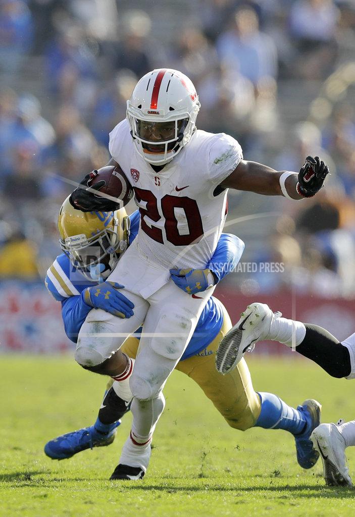 Marcio Jose Sanchez Stanford running back Bryce Love (20) is tackled by UCLA linebacker Tyree Thompson during the second half of an NCAA college football game Saturday, Nov. 24, 2018, in Pasadena, Calif. (AP Photo/Marcio Jose Sanchez)