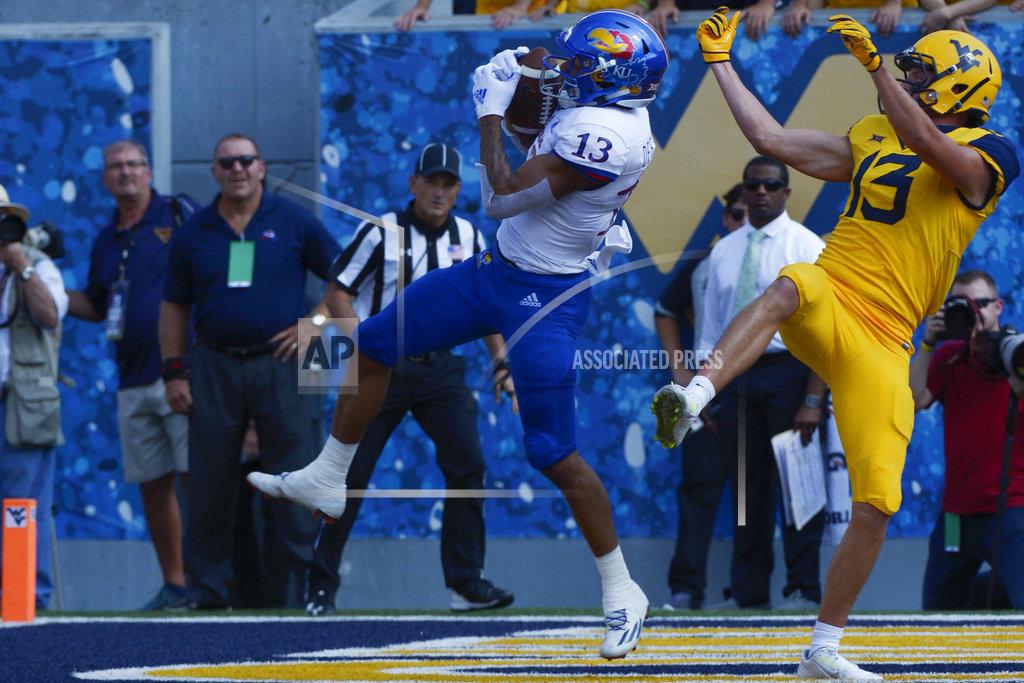 Craig Hudson Kansas cornerback Hasan Defense (13) intercepts a pass in the end zone during intended for West Virginia wide receiver David Sills V (13) during the first half of an NCAA college football game in Morgantown, W. Va., Saturday Oct. 6, 2018. (Craig Hudson/Charleston Gazette-Mail via AP)