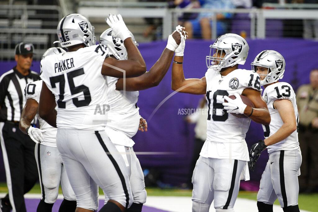 Bruce Kluckhohn Oakland Raiders wide receiver Tyrell Williams (16) celebrates with teammates after catching an 11-yard touchdown pass during the second half of an NFL football game against the Minnesota Vikings, Sunday, Sept. 22, 2019, in Minneapolis. (AP Photo/Bruce Kluckhohn)