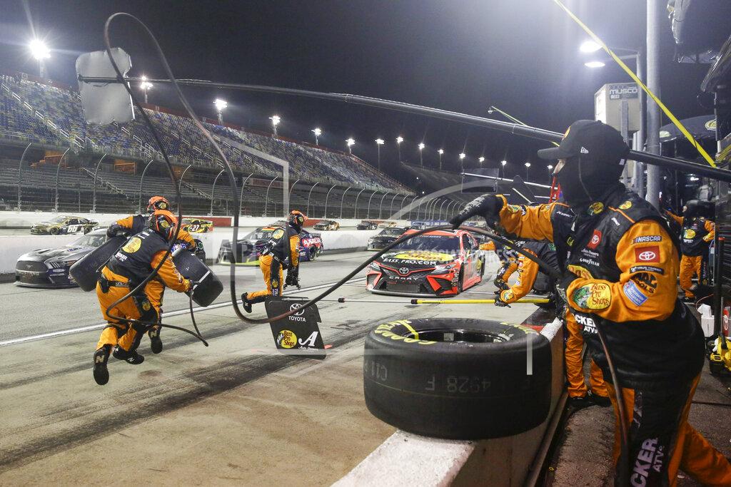 Brynn Anderson The pit crew for Martin Truex Jr. (19) moves into position during the NASCAR Cup Series auto race Wednesday, May 20, 2020, in Darlington, S.C. (AP Photo/Brynn Anderson)