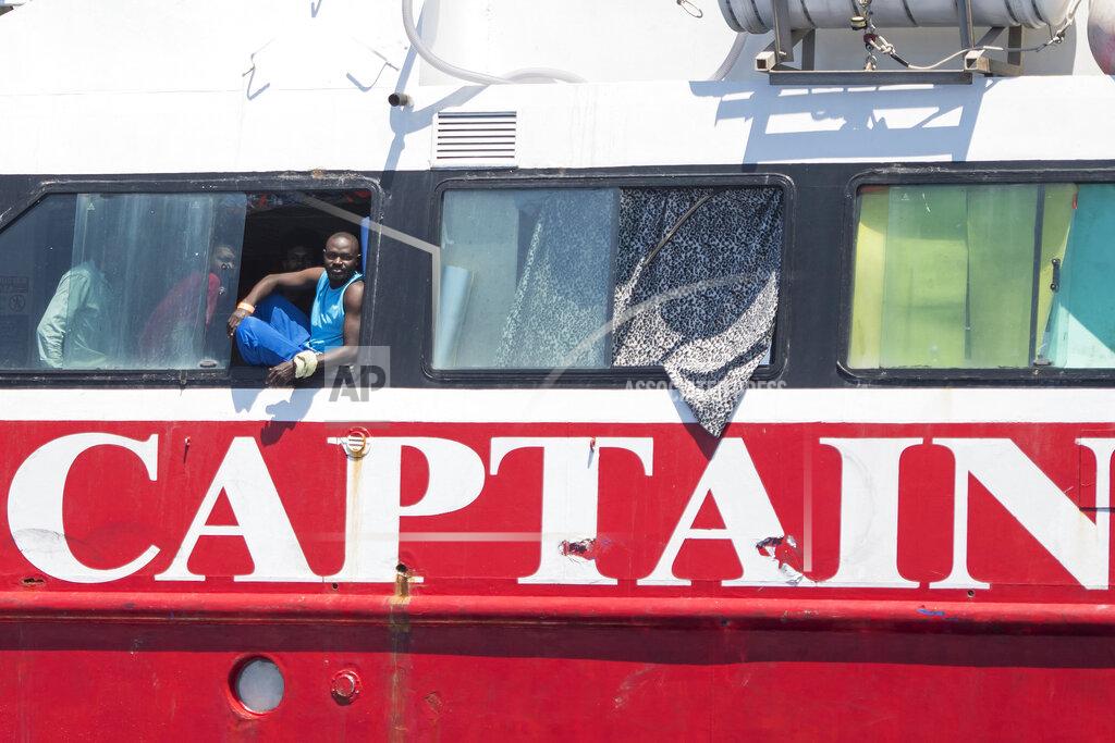 Rene' Rossignaud In this photo taken Tuesday, June 2, 2020, migrants aboard a tourist boats some 20 kilometers from Malta. More than 400 migrants are livingboard pleasure cruise vessels, bobbing in the sea off Malta, many of them for weeks now. Rescued from human traffickers’ unseaworthy boats in several operations in the central Mediterranean since late April, the migrants, along with the Maltese government, are waiting for European Union countries to offer to take them. (AP Photo/Rene' Rossignaud)