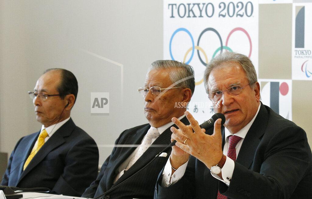 FILE - In this Friday, Aug. 7, 2015 filer, World Baseball Softball Confederation President Riccardo Fraccari, right, accompanied by Japanese baseball legend Sadaharu Oh, left, and Nippon Professional Baseball Commissioner Katsuhiko Kumazaki, speaks to the media at a press conference in Tokyo. For World Baseball Softball Confederation president Riccardo Fraccari, it seems like such a sure home run that he can’t even imagine why anyone wouldn’t want to be involved. No wonder the refusal of Major League Baseball and its players' association to send top stars to the Tokyo Games has frustrated Fraccari for years. Now, with the Olympics postponed for a full year due to the coronavirus pandemic, and the current MLB season on hold, Fraccari has the unexpected opportunity to make one final pitch to the sport’s biggest league. (AP Photo/Ken Aragaki, File)