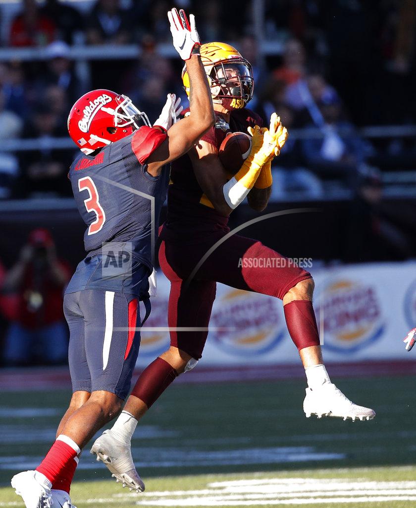 John Locher Arizona State defensive back Chase Lucas (24) makes an interception against Fresno State wide receiver KeeSean Johnson (3) during the second half of the Las Vegas Bowl NCAA college football game, Saturday, Dec. 15, 2018, in Las Vegas. (AP Photo/John Locher)