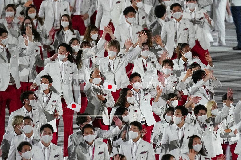 David J. Phillip Athletes from Japan walk during the opening ceremony in the Olympic Stadium at the 2020 Summer Olympics, Friday, July 23, 2021, in Tokyo, Japan. (AP Photo/David J. Phillip)