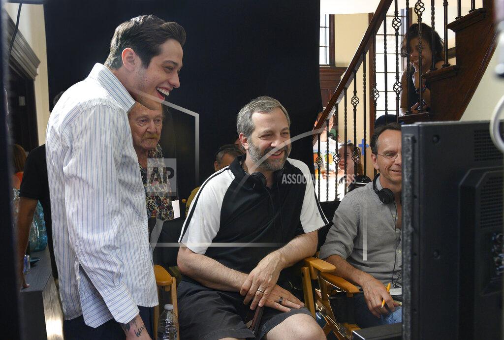 Mary Cybulski In this image released by Universal Pictures, Pete Davidson, left, appears with director Judd Apatow, center, during the filming of "The King of Staten Island." (Mary Cybulski/Universal Pictures via AP)