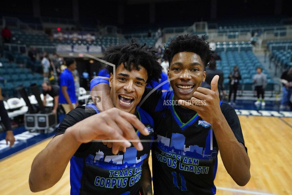 David J. Phillip Texas A&M Corpus Christi's Tyrese Nickelson, left, and Terrion Murdix celebrate after the Southland Conference tournament NCAA college basketball game final against the Southeastern Louisiana Saturday, March 12, 2022, in Katy, Texas. Texas A&M Corpus Christi won 73-65.(AP Photo/David J. Phillip)