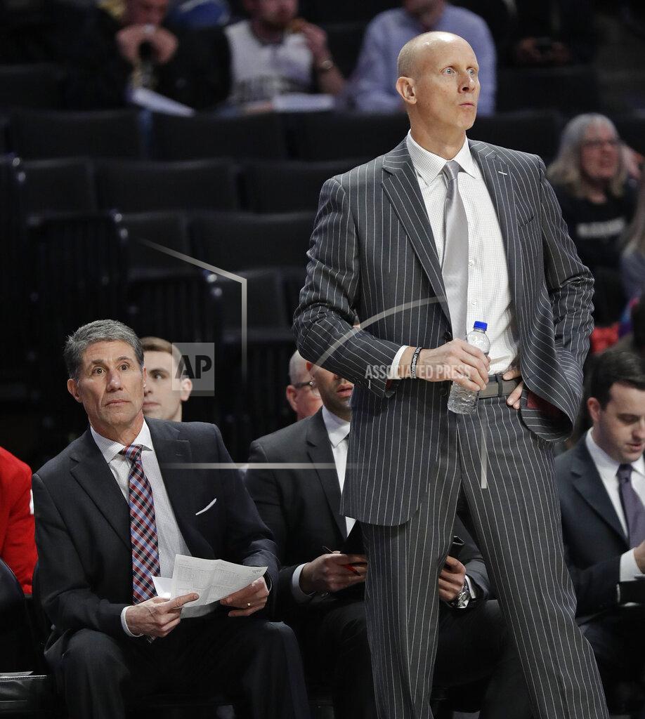Chuck Burton Louisville coach Chris Mack, right, and assistant Dino Gaudio, left, watch during the second half of the team's NCAA college basketball game against Wake Forest in Winston-Salem, N.C., Wednesday, Jan. 30, 2019. (AP Photo/Chuck Burton)