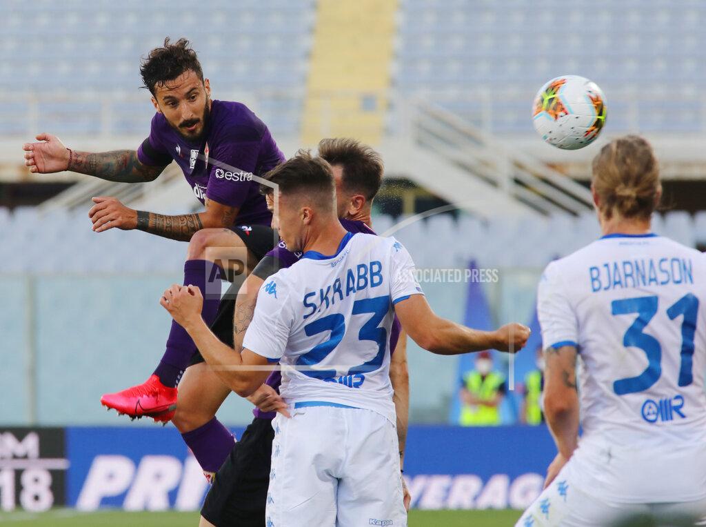 Marco Bucco Fiorentina's Federico Ceccherini, left, jumps for the ball for the ball during the Serie A soccer match between Fiorentina and Brescia at the Artemio Franchi Stadium in Florence, Italy, Monday, June 22, 2020. (Marco Bucco/LaPresse via AP)