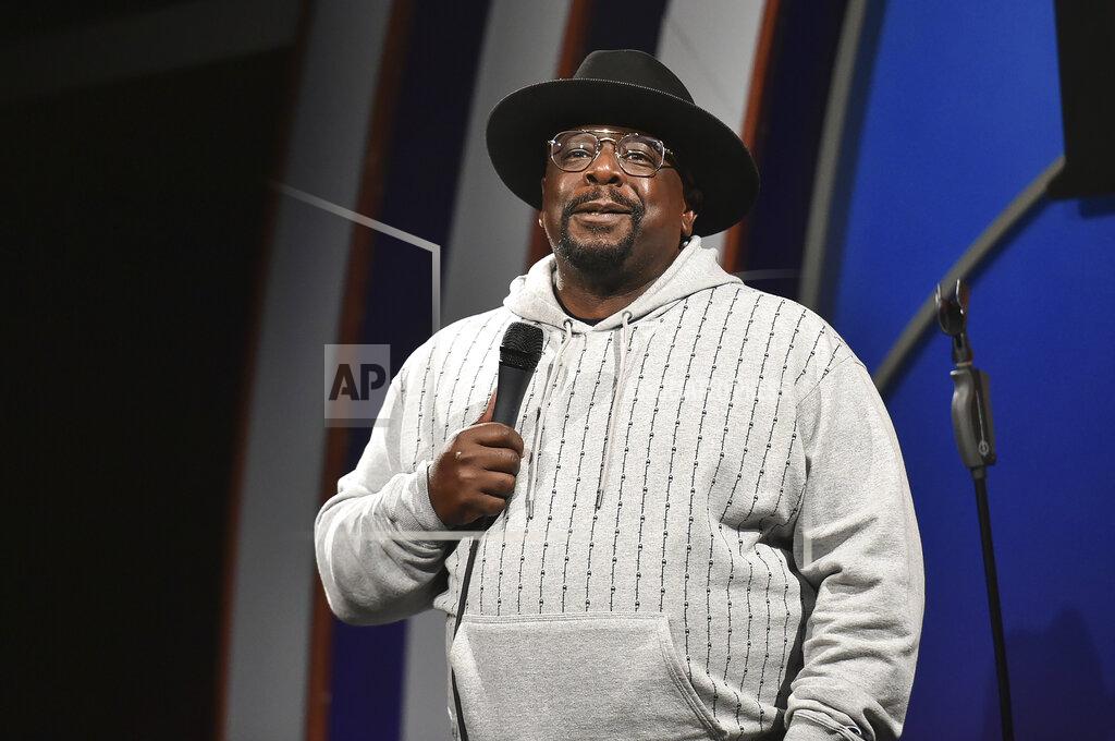 Richard Shotwell FILE - Cedric the Entertainer performs during "Stand Up for Haiti" comedy fundraiser in Los Angeles on Aug. 30, 2021. The comedian and actor will host Sunday’s Emmy ceremony, airing on CBS. (Photo by Richard Shotwell/Invision/AP, File)