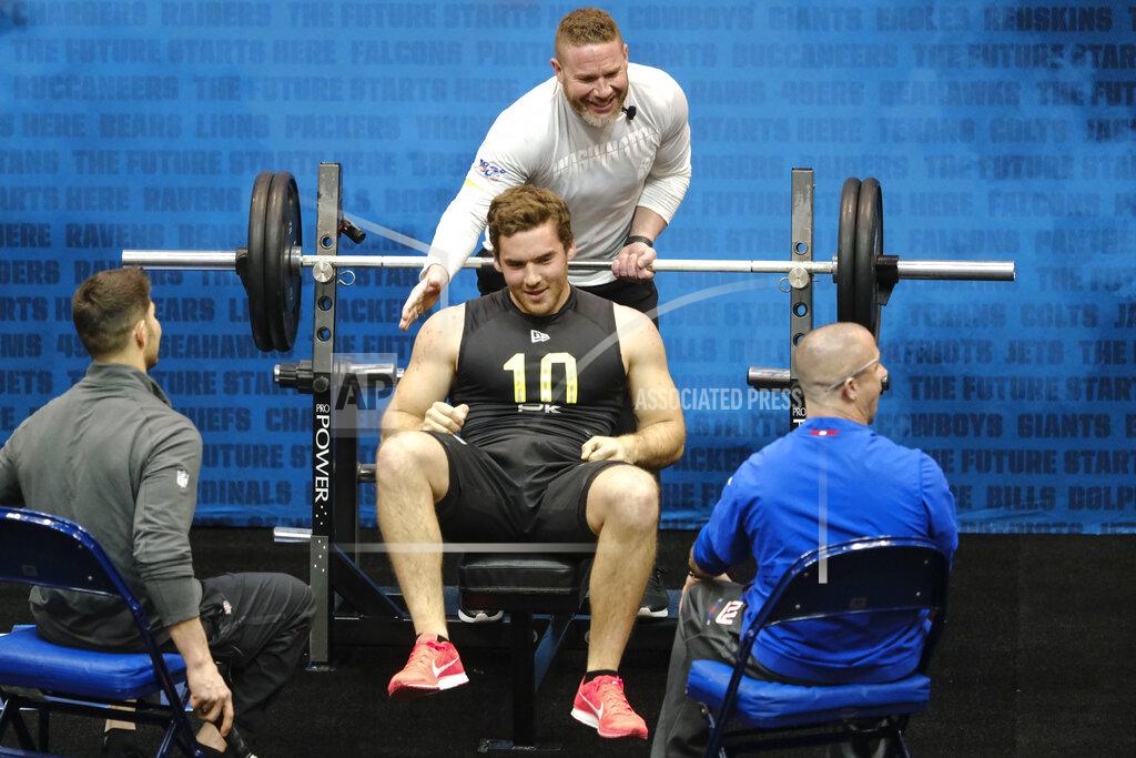 Aj Mast FILE - In this Thursday, Feb. 27, 2020, file photo, Arizona State kicker Michael Turk is congratulated after he bench pressed at the NFL football scouting combine, in Indianapolis. Turk, the nephew of former NFL punter Matt Turk and ex-NFL offensive lineman Daniel Turk, turned heads at the combine when he wowed clubs with his upper-body strength. He recorded 25 reps of the 225-pound bench press, the most by a punter since 2003, per NFL Research. (AJ Mast/AP Images for NFL, File)