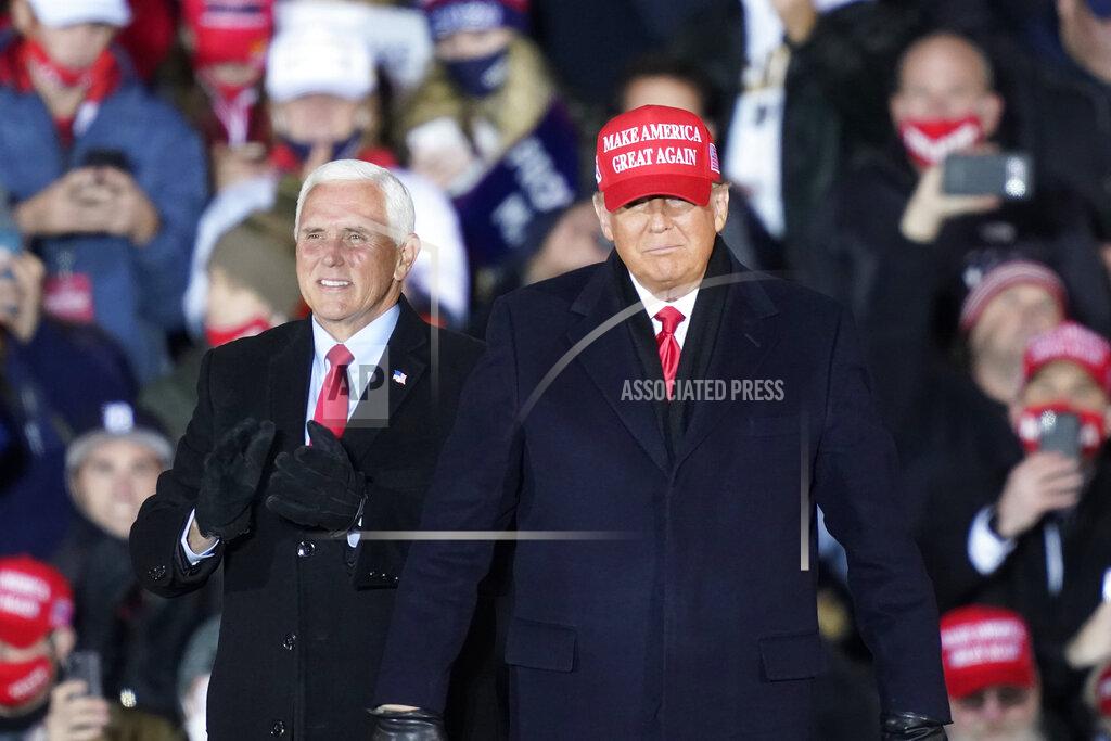 Carlos Osorio President Donald Trump arrives with Vice President Mike Pence for a campaign rally Monday, Nov. 2, 2020, in Grand Rapids, Mich. (AP Photo/Carlos Osorio)