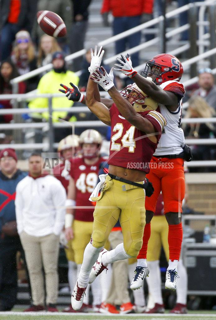 Mary Schwalm Boston College defensive back Taj-Amir Torres (24) breaks up a pass intended for Syracuse wide receiver Nykeim Johnson (82) during the second half of an NCAA college football game, Saturday, Nov. 24, 2018, in Boston. (AP Photo/Mary Schwalm)