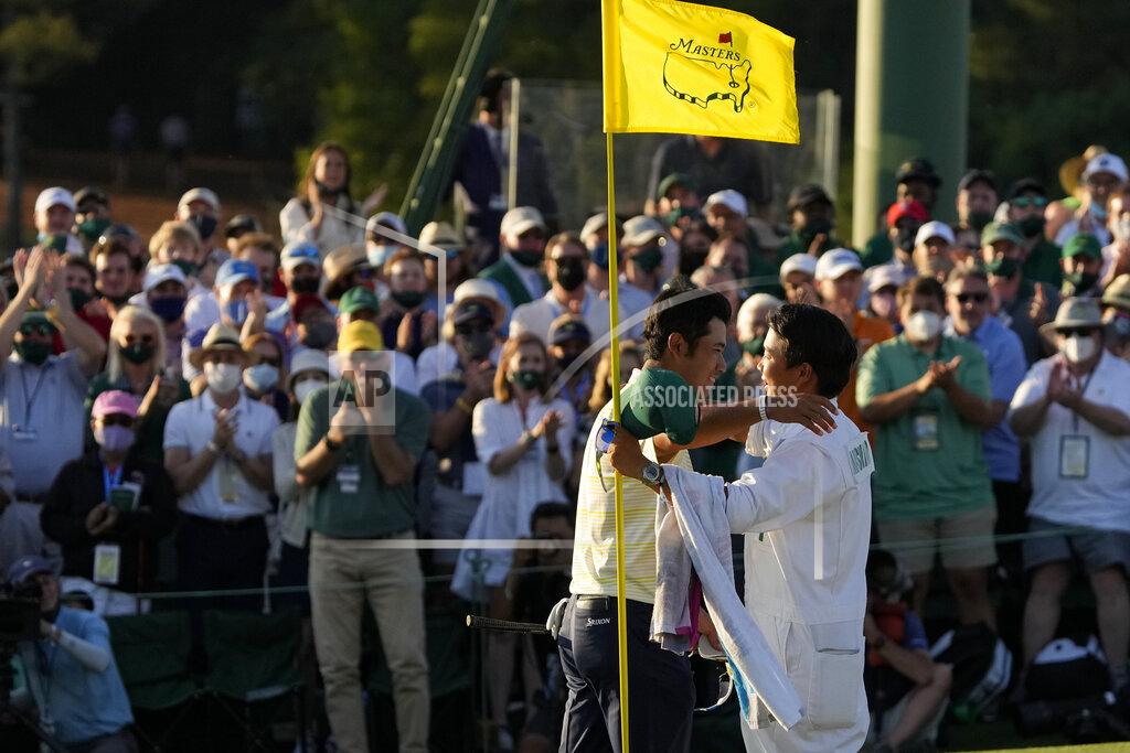 Gregory Bull Hideki Matsuyama, of Japan, hugs his caddie Shota Hayafuji after winning the Masters golf tournament on Sunday, April 11, 2021, in Augusta, Ga. (AP Photo/Gregory Bull)
