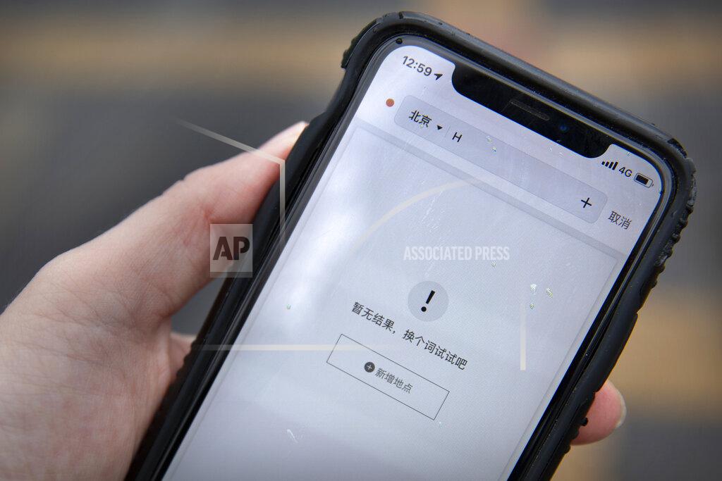 Mark Schiefelbein The Chinese ride-hailing app Didi Chuxing shows the message "no results, try another search term" when searching for destinations beginning with the letter H in Beijing, Friday, March 26, 2021. H&M disappeared from the internet in China as the government raised pressure on shoe and clothing brands and announced sanctions Friday against British officials in a spiraling fight over complaints of abuses in the Xinjiang region. (AP Photo/Mark Schiefelbein)