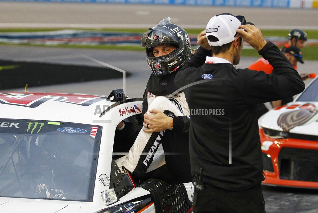 John Locher Kevin Harvick gets out of his car after winning the pole position during qualifying for a NASCAR Cup Series auto race at the Las Vegas Motor Speedway, Friday, March 1, 2019, in Las Vegas. (AP Photo/John Locher)